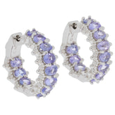 Elegant oval purple sapphire sterling silver earrings, featuring sparkling gemstones and a luxurious design.